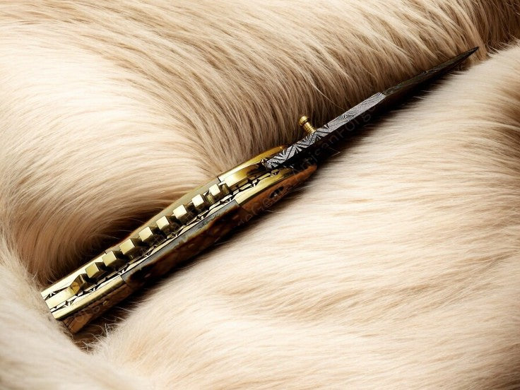 Close-up of Fish Engraving on Bone Handle of Cute Folding Knife