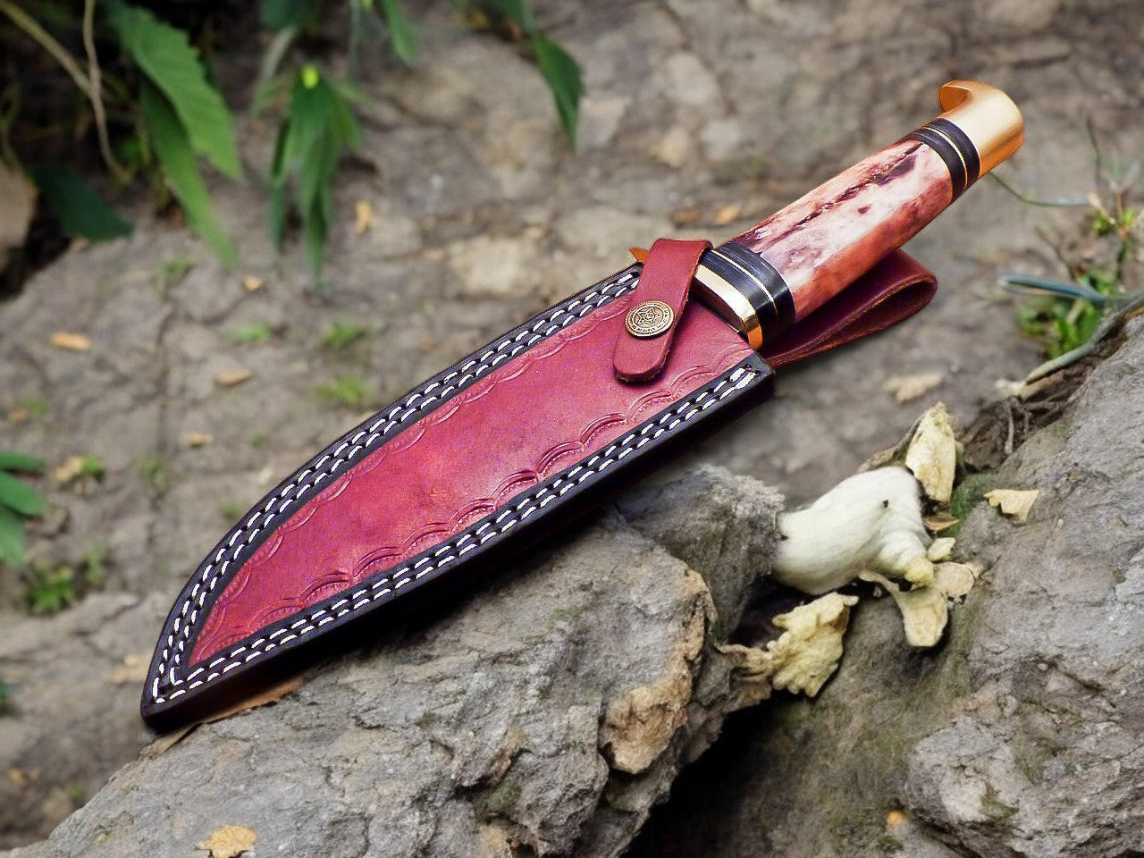 Full view of the 12-inch deer hunting knife displayed on a rustic wooden surface.