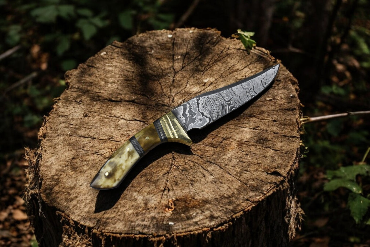 Close-up of the Damascus steel blade of a skinning knife.
