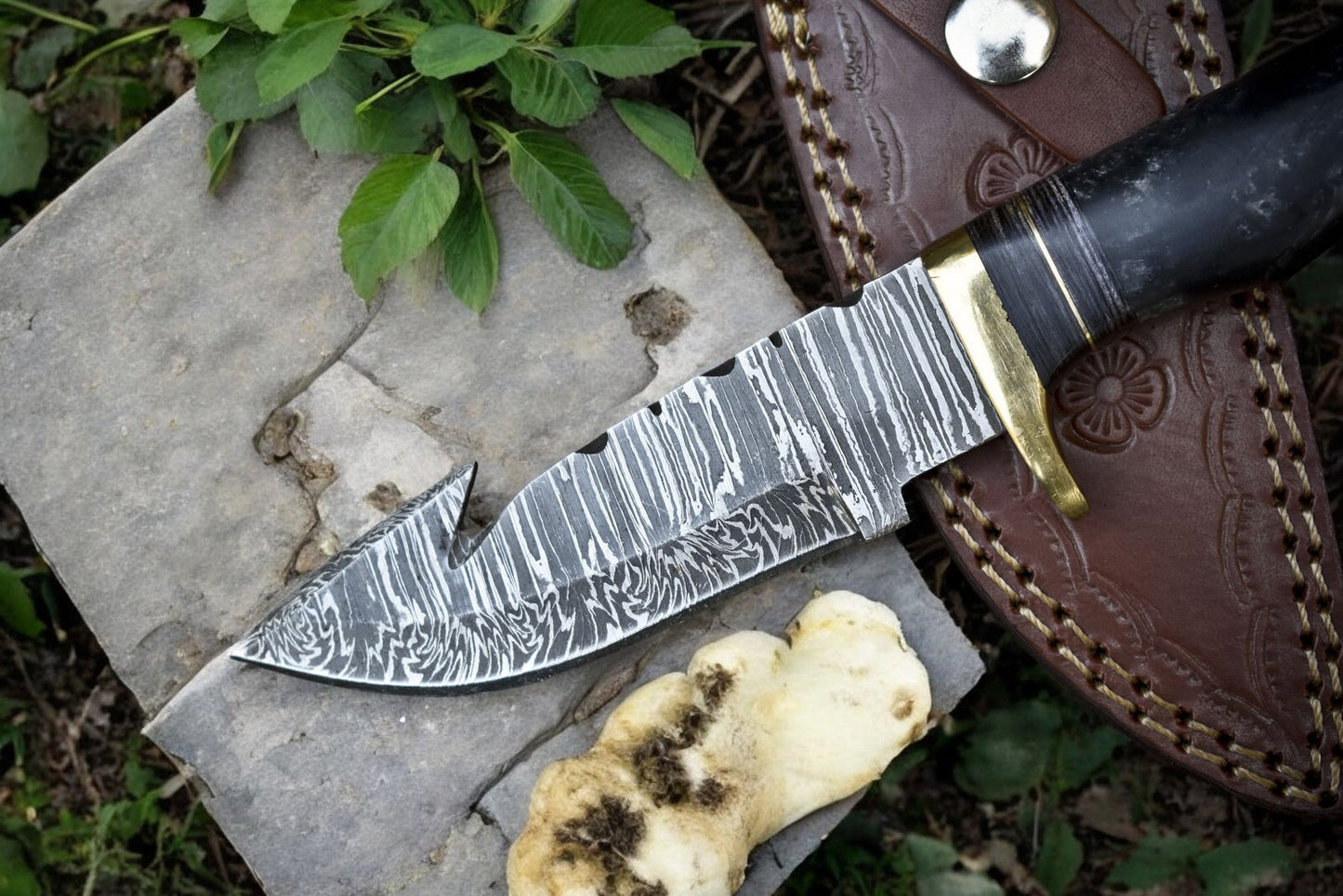 Epoxy resin handle of the custom hunting knife with brass guard for added grip.
