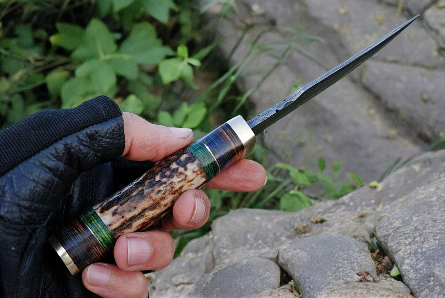 Close-up of the 3.75-inch Damascus steel blade showcasing its unique pattern.