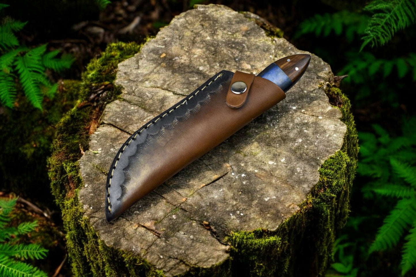 Leather sheath accompanying handmade Damascus steel skinning knife.