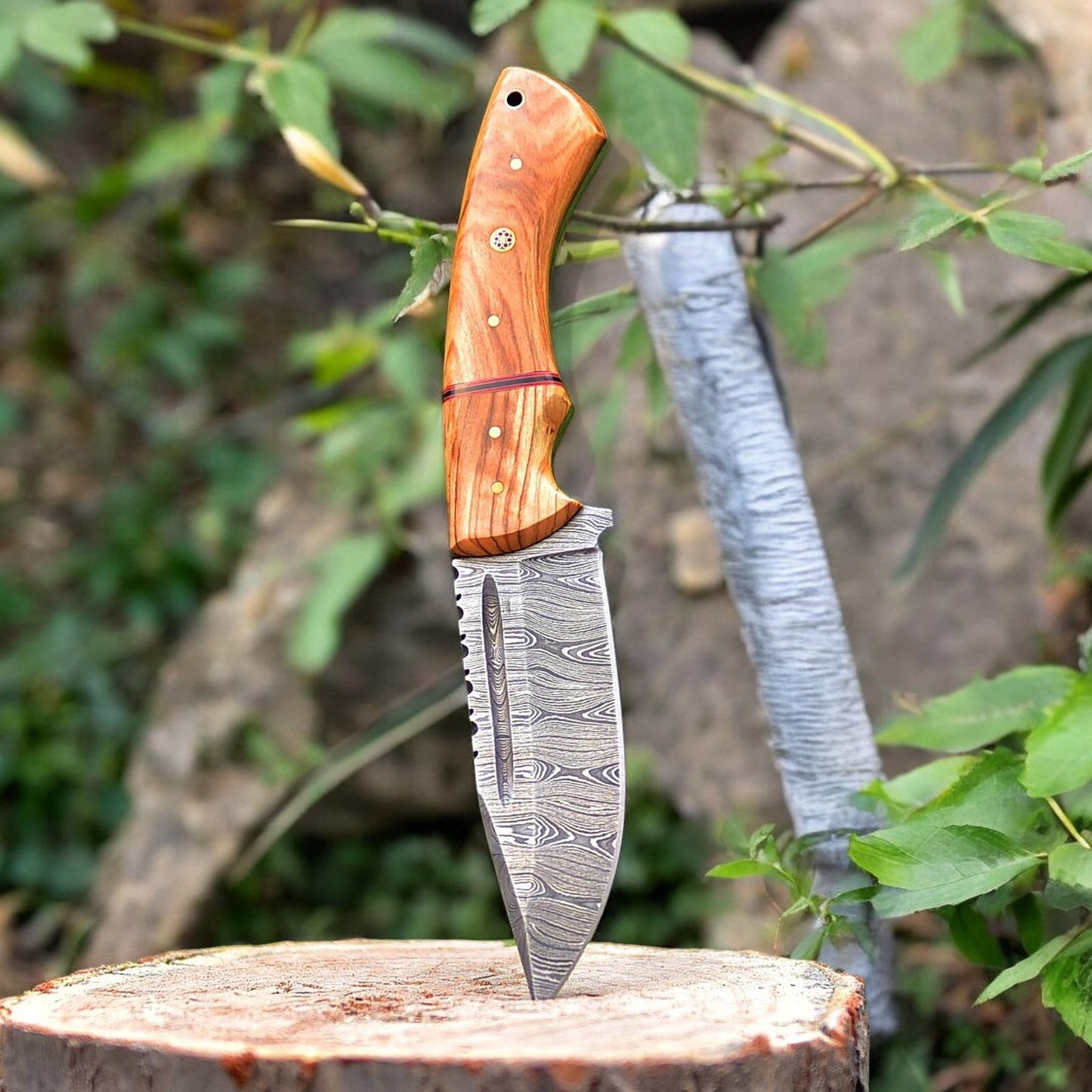 Close-up of Damascus steel blade on a high end hunting knife, showcasing its pattern.