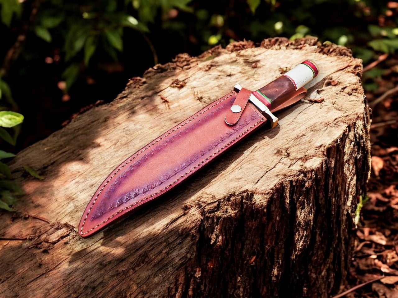 Full view of hand forged Bowie knife with leather sheath