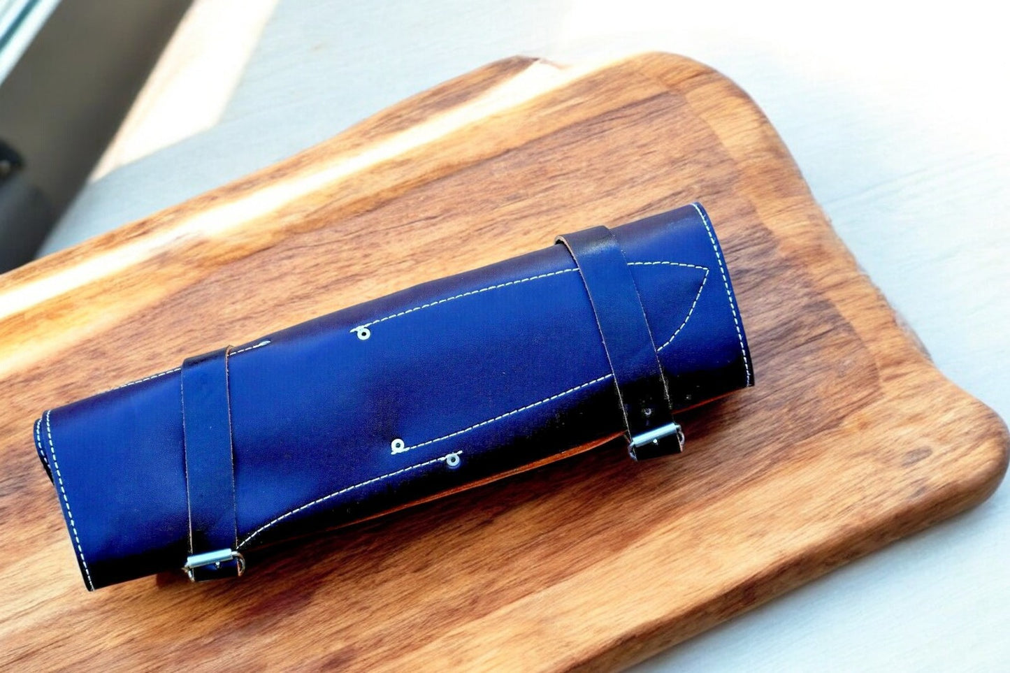 Handmade chef knives in leather roll, ready for storage