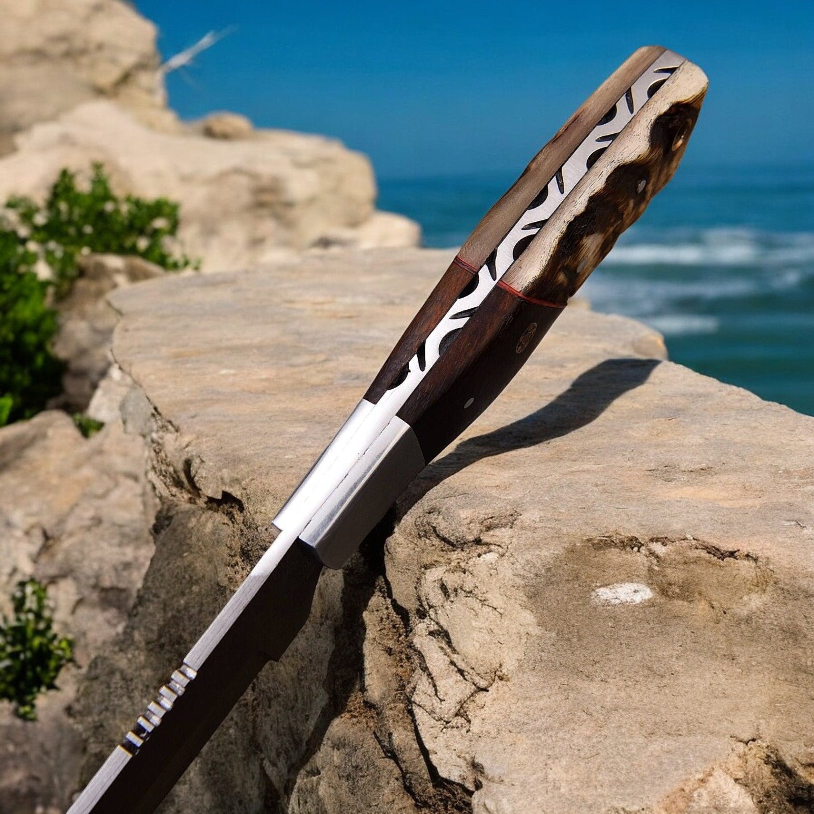 Side view of the hunting knife emphasizing the balance and length.