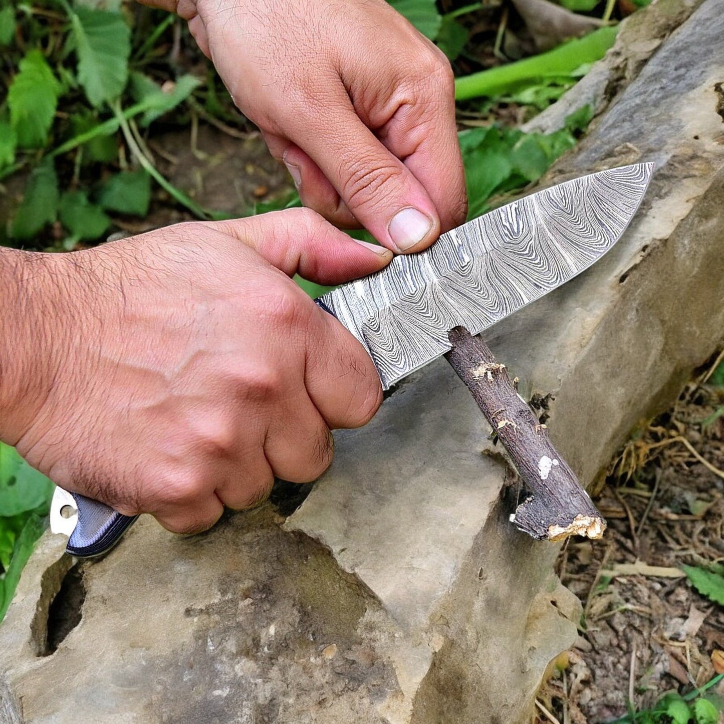 Luxury hunting knife in leather sheath with Damascus steel blade displayed.