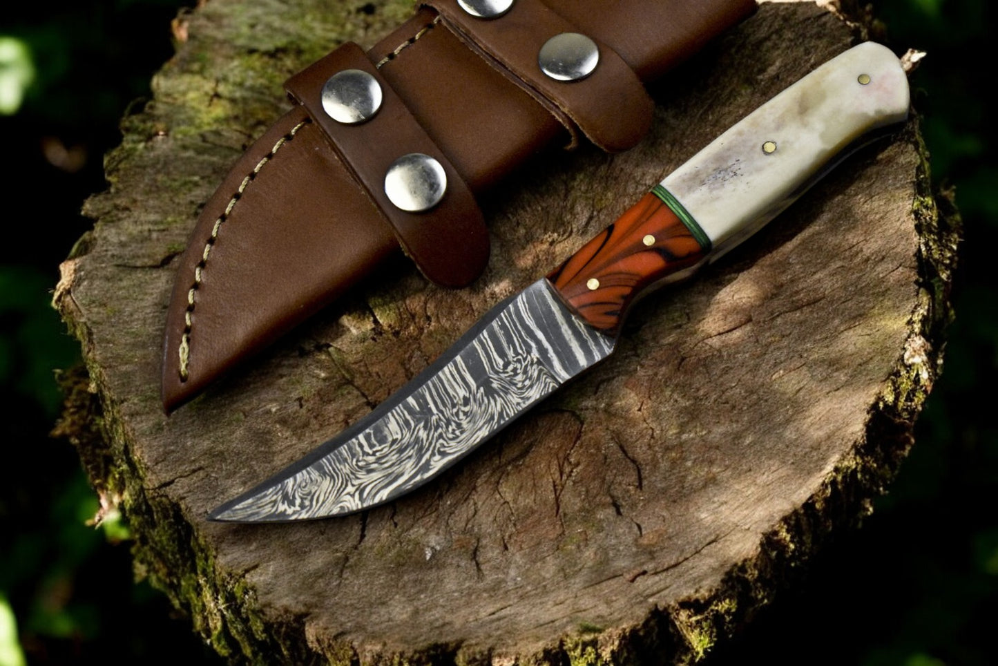 Handmade Victorinox skinning knife with Damascus steel blade and epoxy-bone handle.