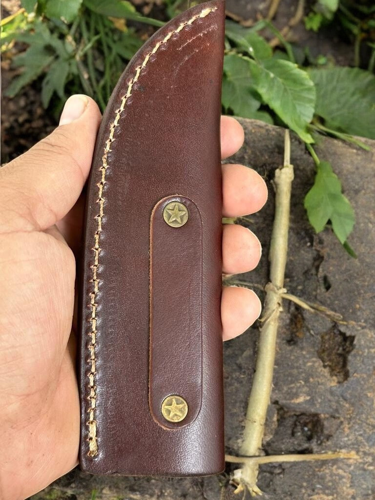 Close-up of Damascus Steel Blade on Custom Hunting Knife
with leather sheath