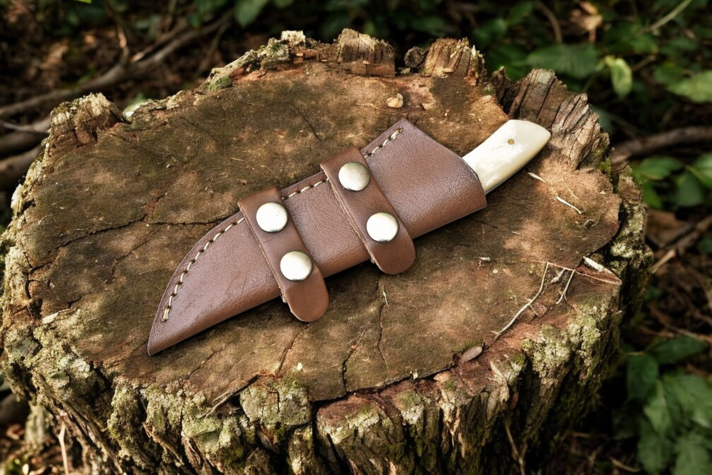Full view of the custom butcher skinning knife with leather sheath.