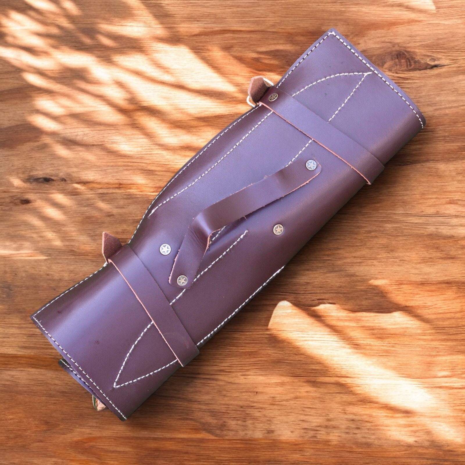 Compact and stylish leather roll for Damascus knives.