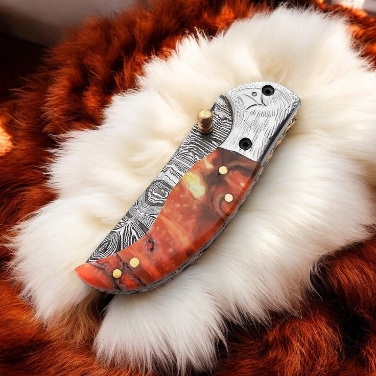 Epoxy Resin Handle Damascus Pocket Knife with Intricate Steel Bolster
