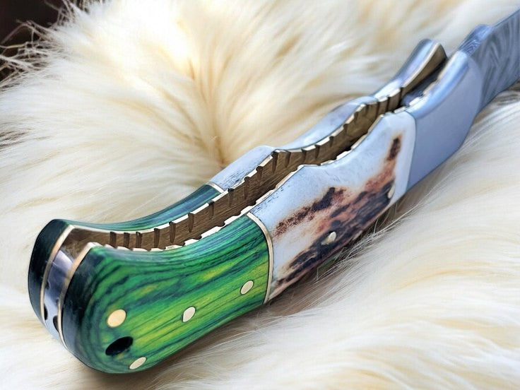 Close-up of Damascus Steel Blade on Folding Knife
