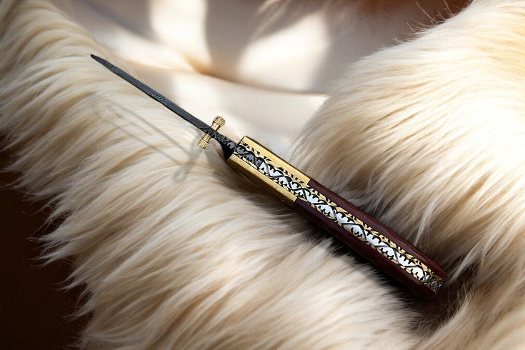 Close-up of the 3.25-inch Damascus steel blade on pocket knife