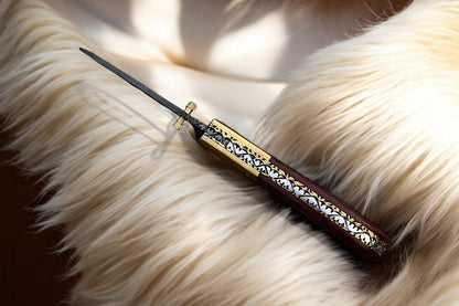 Close-up of the 3.25-inch Damascus steel blade on pocket knife