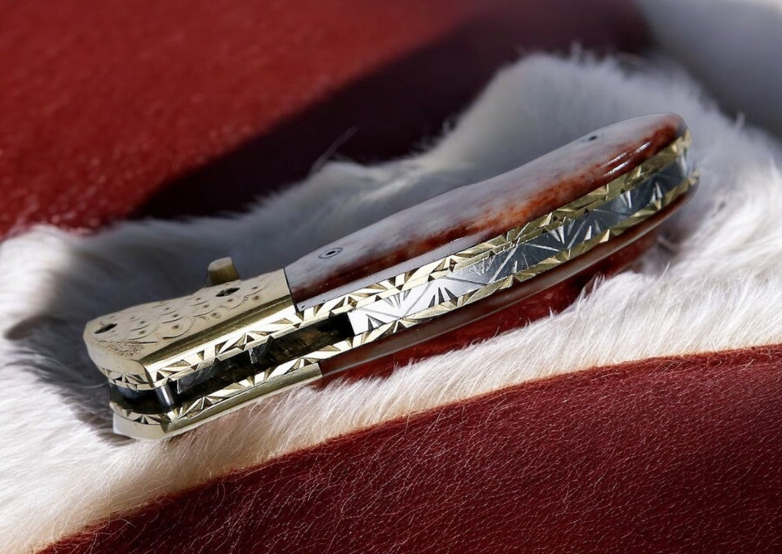  Close-up of the Damascus steel blade on pocket knife with liner lock