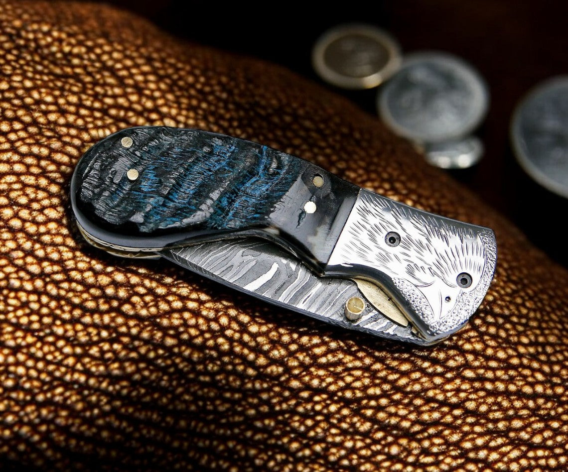 Damascus pocket knife with leather case and liner lock mechanism