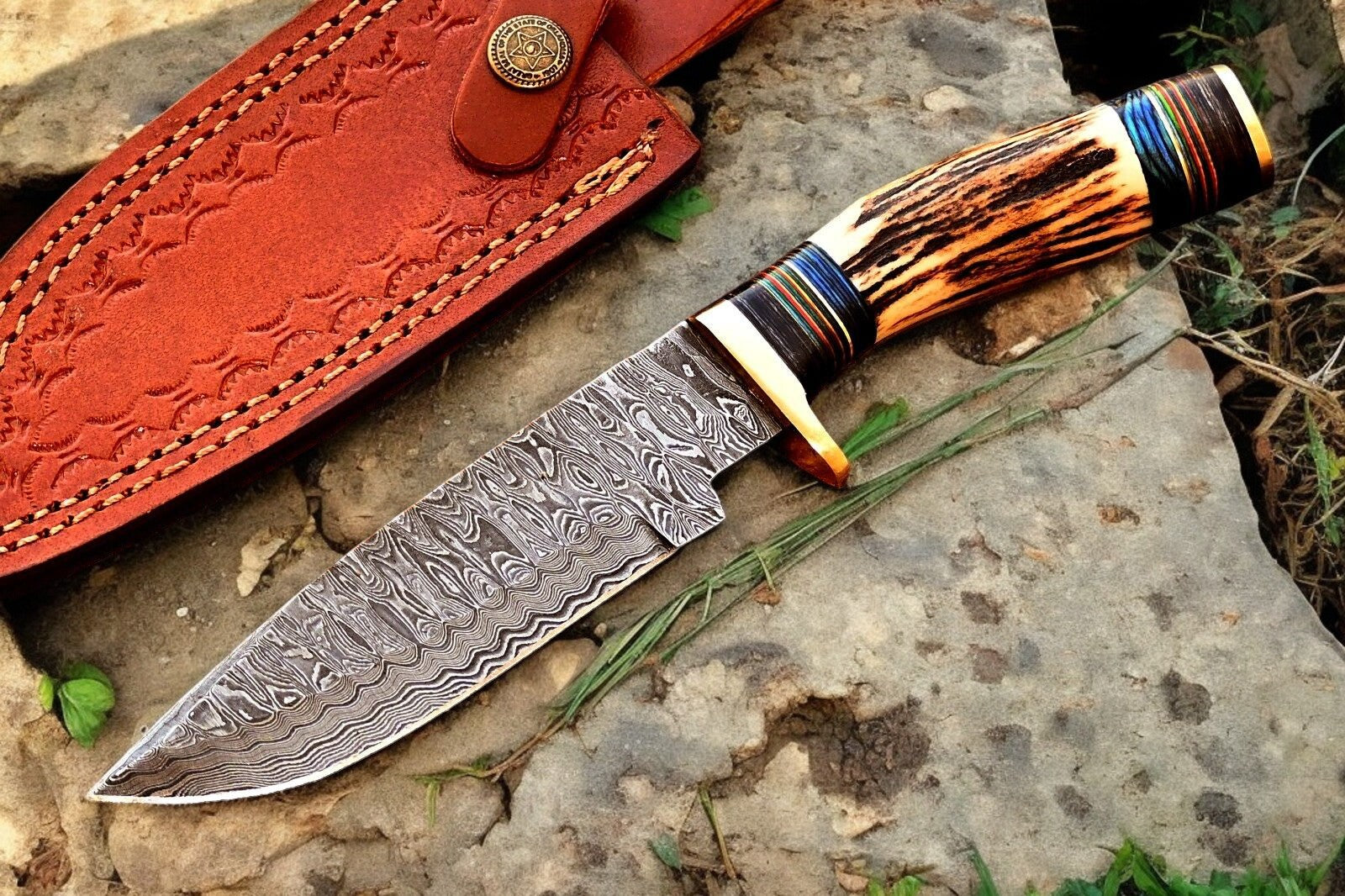 Close-up of the blade edge on the Damascus hunting knife, emphasizing sharpness.
