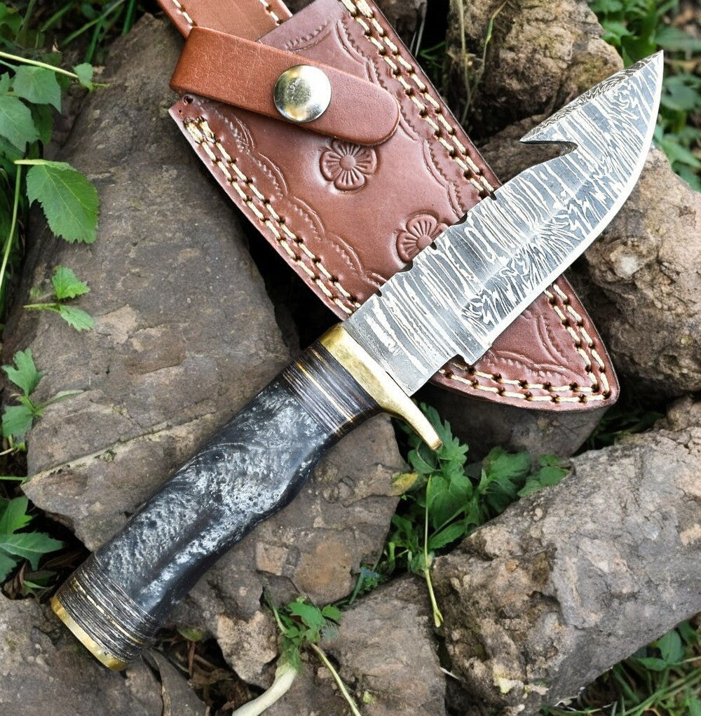 Custom hunting knife in use, demonstrating its sharpness and precision.
