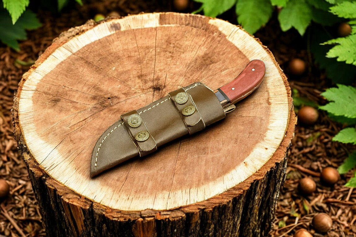 Leather sheath detail of the high-end hunting knife with elegant stitching.