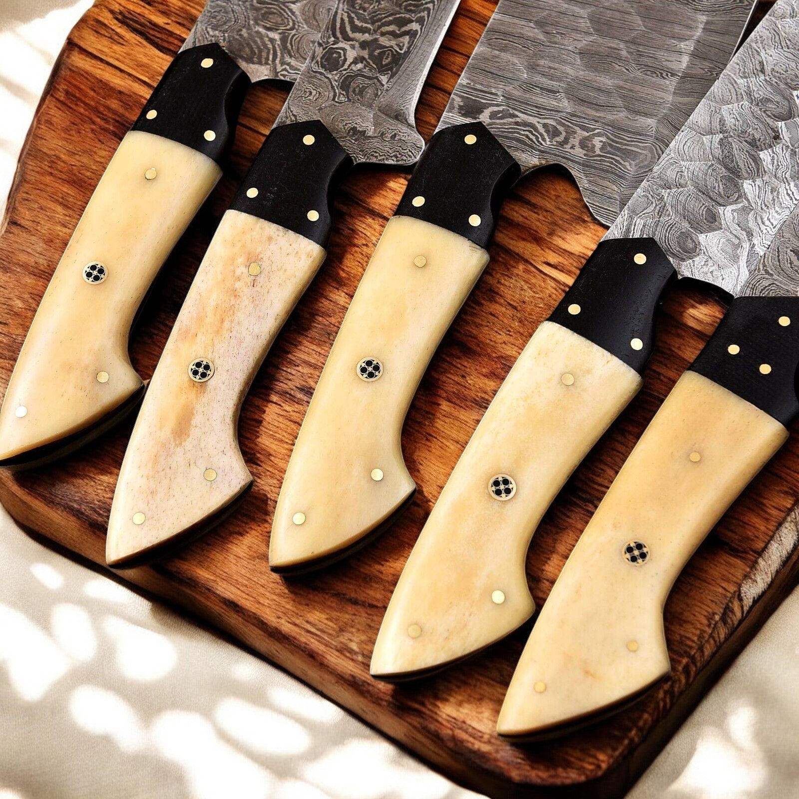 Premium forged Damascus chef knife with buffalo horn grip.
