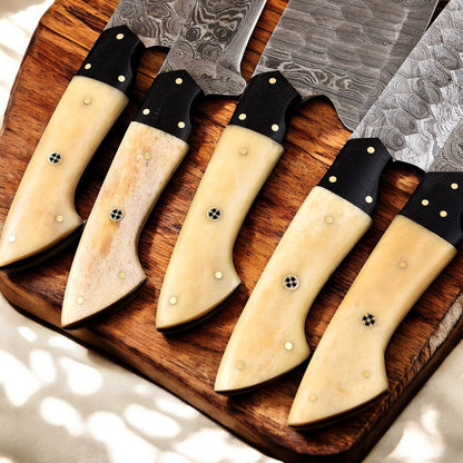 Premium forged Damascus chef knife with buffalo horn grip.
