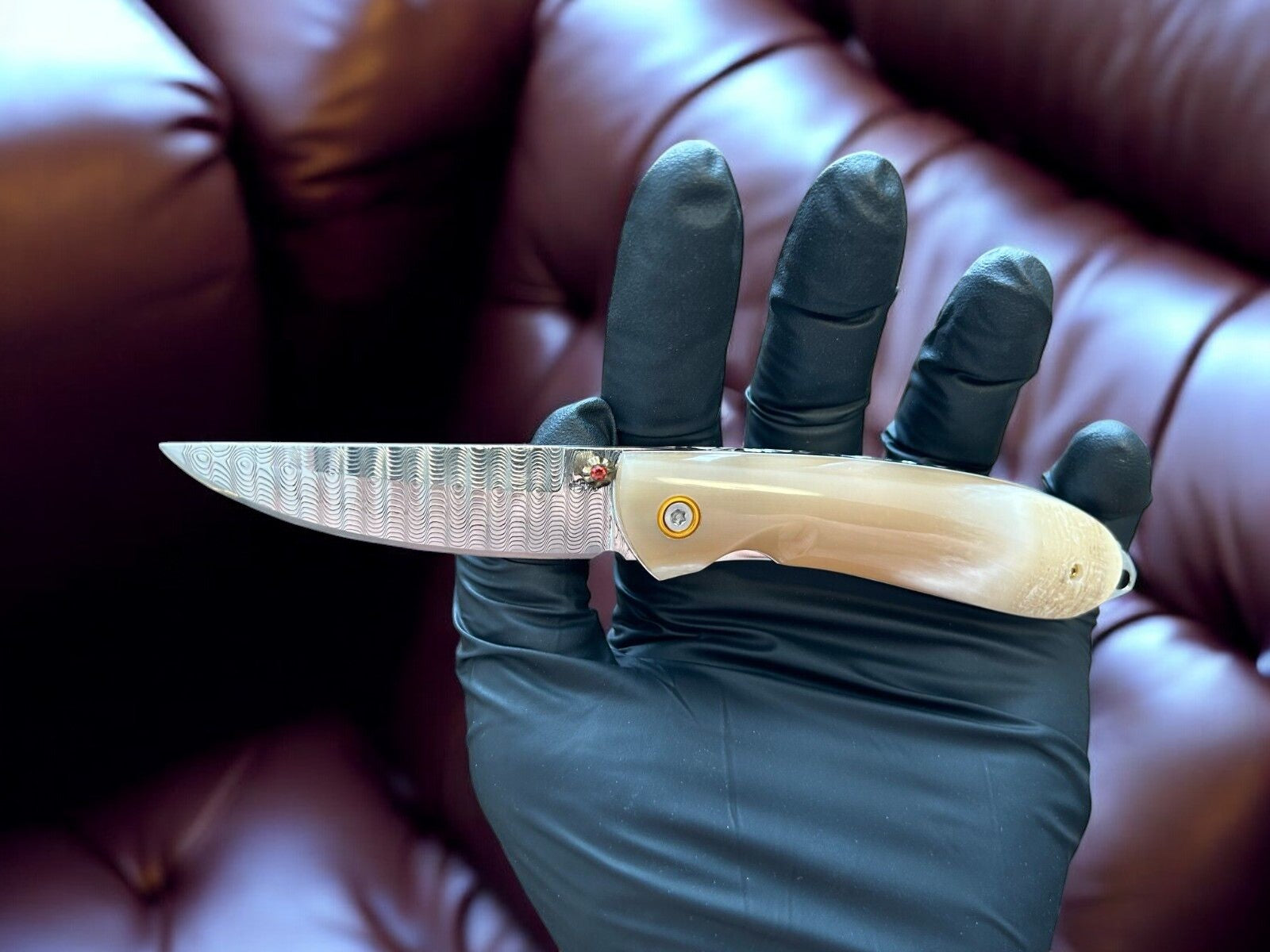 "Custom handmade EDC knife with a 3-inch damascus steel blade."
