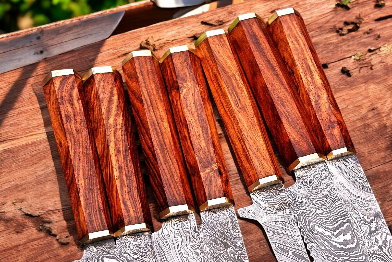 rosewood handle of the Damascus kitchen knife.
