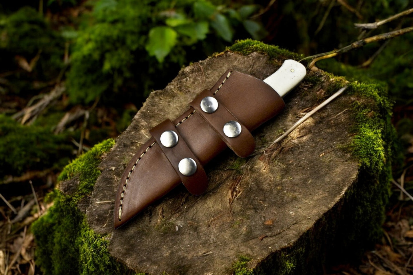 skinning knife with leather sheath.
