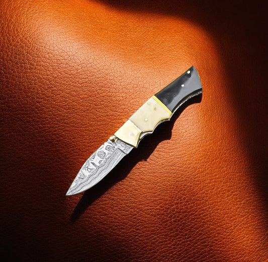 "Handmade Damascus pocket knife with bone and buffalo horn handle"
