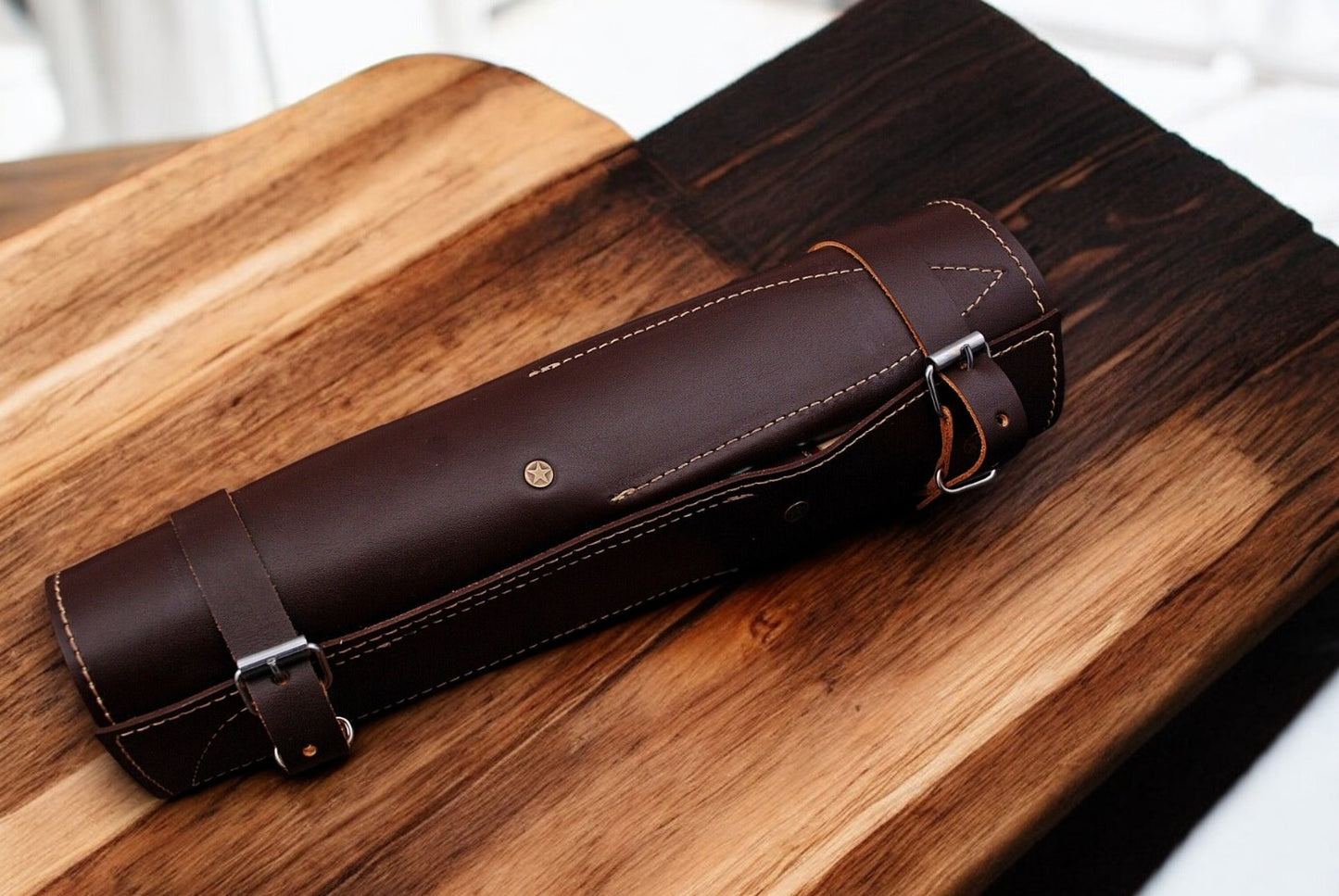 Leather roll for storing custom kitchen knives.
