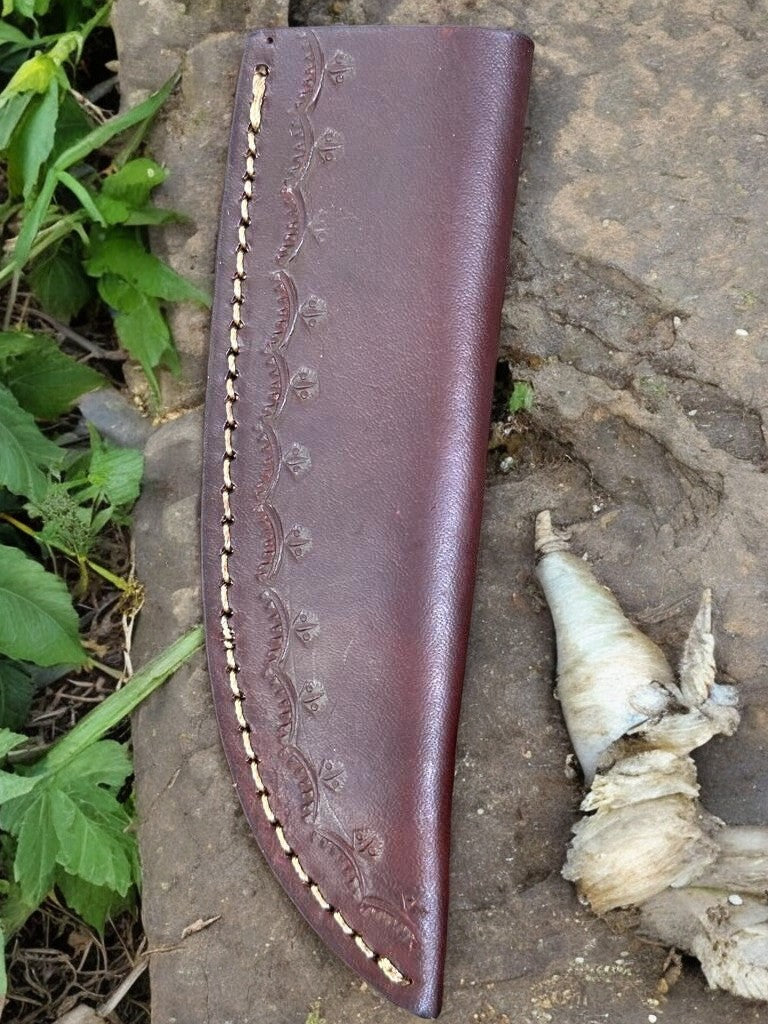 Leather sheath included with Damascus knife hunting, displayed beside the knife.

