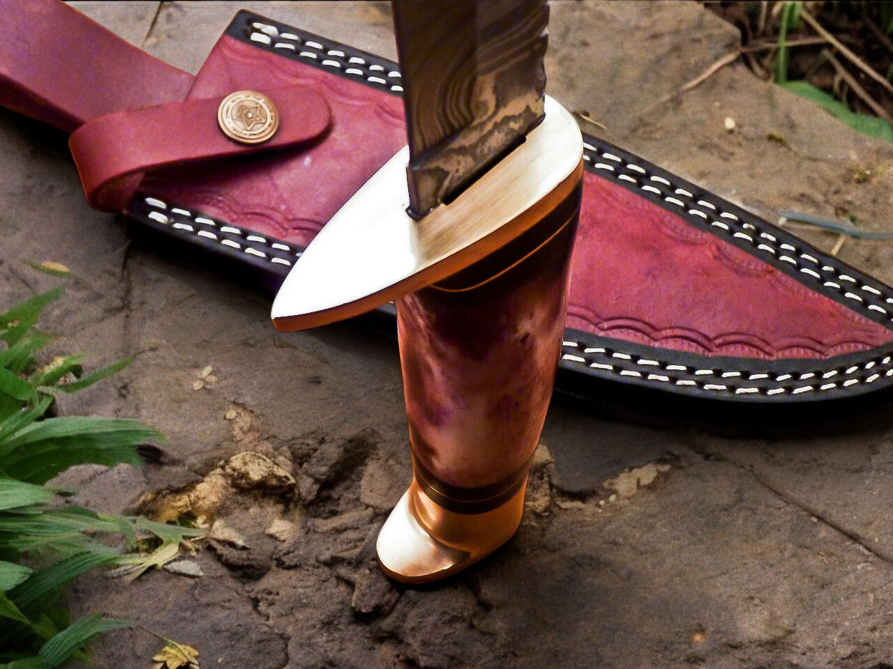 Deer hunting knife in its leather sheath, ready for outdoor adventures.
